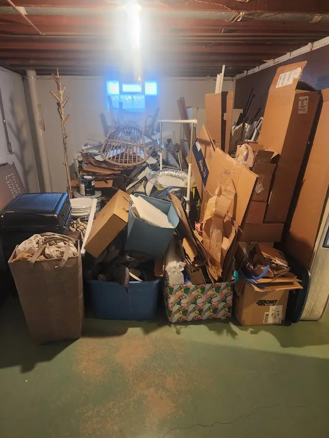 Roll-off dumpster container at job site for 2 Yard Dumpster Rental in Franklin